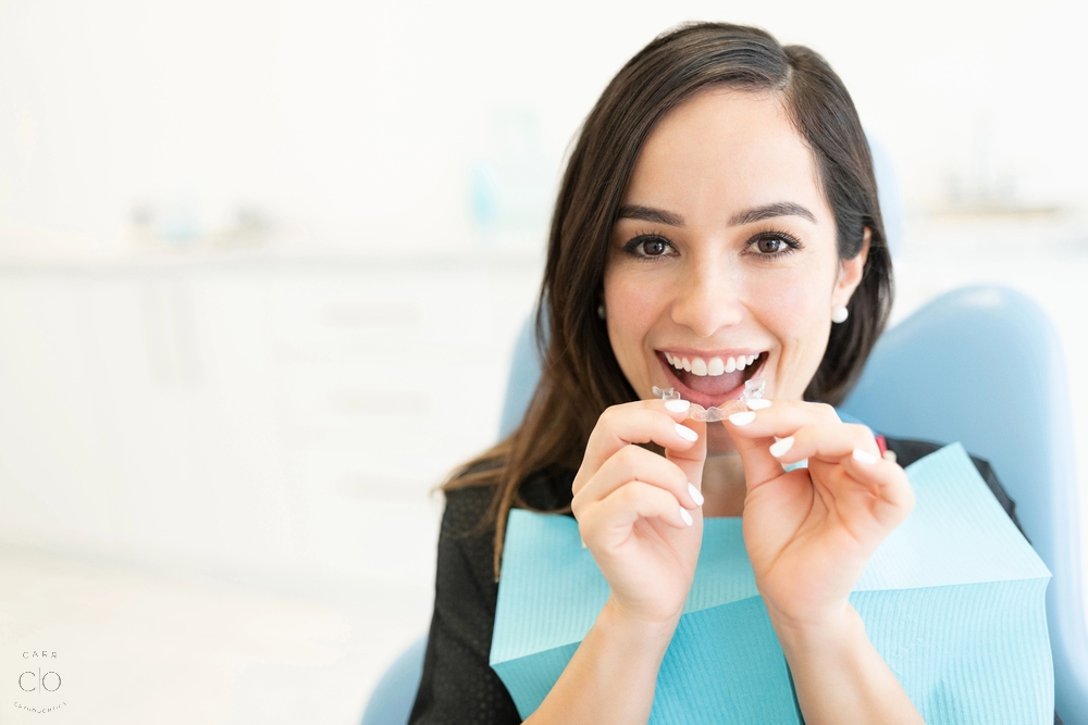 happy mid adult woman clear invisalign clear aligners - How Does Invisalign Work in Fairview, TN